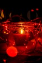 Modern advent wreath made of four glass jars, fake snow and red candles. Christmas decoration Royalty Free Stock Photo