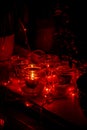 Modern advent wreath made of four glass jars, fake snow and red candles. Christmas decoration Royalty Free Stock Photo