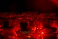 Modern advent wreath made of four glass jars, fake snow and red candles. Christmas decoration Royalty Free Stock Photo