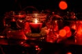 Modern advent wreath made of four glass jars, fake snow and red candles. Christmas decoration Royalty Free Stock Photo