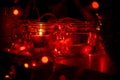 Modern advent wreath made of four glass jars, fake snow and red candles. Christmas decoration Royalty Free Stock Photo