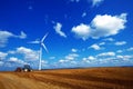Modern agriculture, wind turbine and tractor