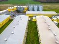 Modern agro-industrial complex top view. Flying a drone over a large chicken farm, raising broiler chickens for meat. Rows of Royalty Free Stock Photo