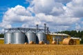 Modern agro manufacturing plant with metal silos for processing drying cleaning and storage of agricultural products, flour, Royalty Free Stock Photo