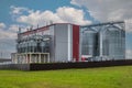 modern agro-processing plant for processing and silos for drying cleaning and storage of agricultural products, flour, cereals and Royalty Free Stock Photo