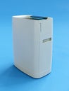 Modern air cleaner on blue background