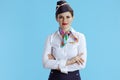 modern air hostess woman on blue in uniform Royalty Free Stock Photo