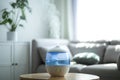 Modern air humidifier on table in room Royalty Free Stock Photo