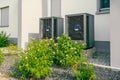 Modern air source heat pumps installed outside of new and modern city house Royalty Free Stock Photo