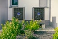 Modern air source heat pumps installed outside of new and modern city house Royalty Free Stock Photo