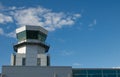Modern air traffic control tower in international passenger airport over blue sky with copy space Royalty Free Stock Photo