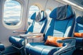 Modern aircraft cabin with comfortable seats in blue tones. Royalty Free Stock Photo