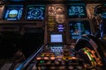 Modern airplane cockpit with illuminated instruments - detail view - during night time flight Royalty Free Stock Photo