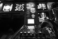 Modern airplane cockpit with illuminated instruments - detail view - during night time flight Royalty Free Stock Photo