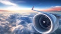 Modern Airplane Engine Cruising Above a Breathtaking Sunset, with a Vast Cloudscape Below Royalty Free Stock Photo