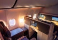 Modern airplane interiors, luxury first class and business class seats with entertainment area Royalty Free Stock Photo