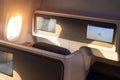 Modern airplane interiors, luxury first class and business class seats with entertainment area Royalty Free Stock Photo