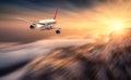 Modern airplane mith motion blur effect is flying over low cloud Royalty Free Stock Photo