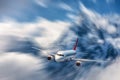 Modern airplane mith motion blur effect at sunny bright day. Lan Royalty Free Stock Photo