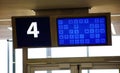 Modern airport departure gate waiting area with gate number