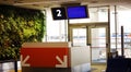 Modern airport departure gate waiting area with gate number