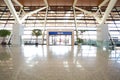 Modern airport interior glass wall aisle window Royalty Free Stock Photo