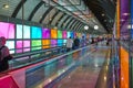 Modern airport moving walkway indoor with travelers. Transport corridor