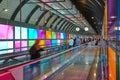 Modern airport moving walkway indoor with travelers. Transport corridor Royalty Free Stock Photo