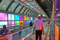 Modern airport moving walkway indoor with travelers. Transport corridor Royalty Free Stock Photo