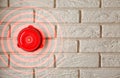 Modern alarm bell on brick wall indoors Royalty Free Stock Photo