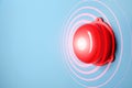 Modern alarm bell on color background