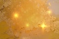 Modern amber yellow and gold background with paint splash and golden glitter