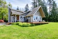 Modern American farm house with spring landscape. Royalty Free Stock Photo