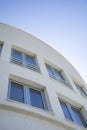 Modern apartment building exterior, Detail of a modern building with blue sky in the background. Royalty Free Stock Photo