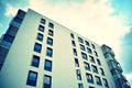 Modern apartment building exterior. Retro colors stylization Royalty Free Stock Photo