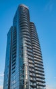 Modern apartment buildings in downtown Vancouver BC Canada. Angular Glass Tower Buildings Against Blue Sky Royalty Free Stock Photo