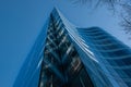 Modern apartment buildings in downtown Vancouver BC Canada. Angular Glass Tower Buildings Against Blue Sky Royalty Free Stock Photo