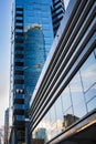 Modern apartment buildings in downtown Vancouver BC Canada. Angular Glass Tower Buildings Against Blue Sky Royalty Free Stock Photo