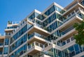 Modern apartment buildings exteriors in sunny day. Cityscape with facade of a modern housing construction with balconies Royalty Free Stock Photo