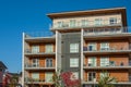 Modern apartment buildings exteriors in sunny day. Cityscape with facade of a modern housing construction with balconies Royalty Free Stock Photo