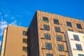 Modern apartment buildings on a sunny day. Multistoried new stylish living block. Facade of a modern apartment building. Royalty Free Stock Photo