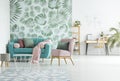 Modern apartment with turquoise couch Royalty Free Stock Photo