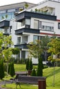Modern apartments building, with garden, bushes and trees, portrait image Royalty Free Stock Photo