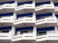 modern apartments with white balconies and blue details with angular railings Royalty Free Stock Photo