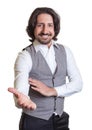 Modern arabian man inviting his guests Royalty Free Stock Photo