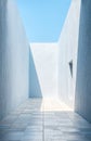 Modern architectural corridor with bright sunlight and minimalist design in a serene outdoor setting Royalty Free Stock Photo