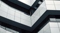 Modern architectural design featuring angular lines and reflective surfaces in urban setting