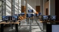 Modern architectural design studio with multiple computer workstations displaying 3d models Royalty Free Stock Photo