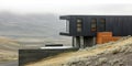Modern architectural masterpiece in a remote landscape surrounded by rolling hills and mist Royalty Free Stock Photo