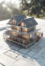 Modern architectural model on blueprint in sunlight, symbolizing future construction Royalty Free Stock Photo